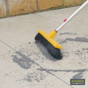 Brush in grout